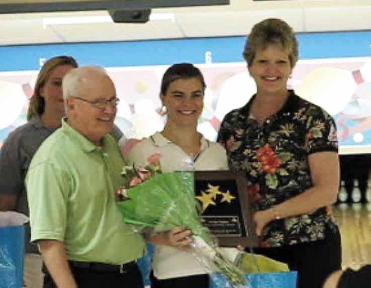 Lisa Huber, flanked by White Oak Lanes proprietor Ralph Curry, and WNDA's Jackie Adams